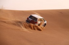 Dubai Red Dunes safari BBQ dinner, sand boarding and camel ride